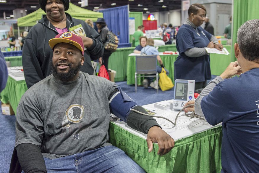 Trenin Jones gets his blood pressure taken at the GW Ron and Joy Kidney Center/GW Transplant Institute booth at the NBC4 Health and Fitness Expo on Jan. 9, 2016