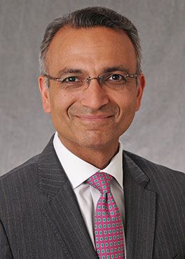 Dr. Farzad Najam posing for a portrait