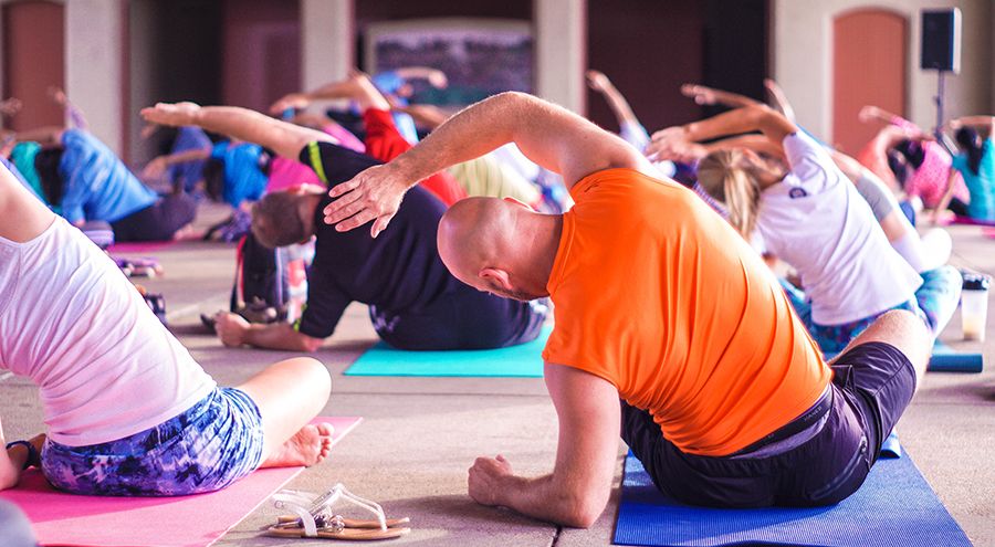 People stretch during a yoga class