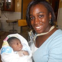 Aishat Olatunde holding a baby
