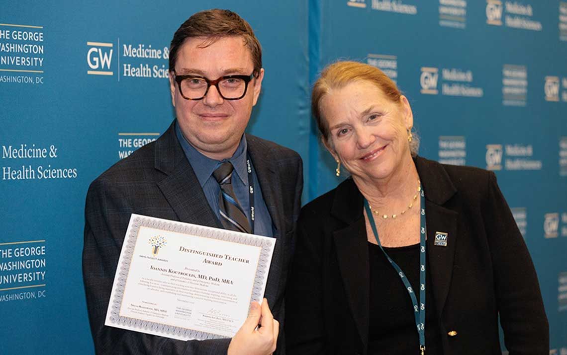 Award winner Ionnis Koutroulis (left) with Dean Barbara Bass (right)
