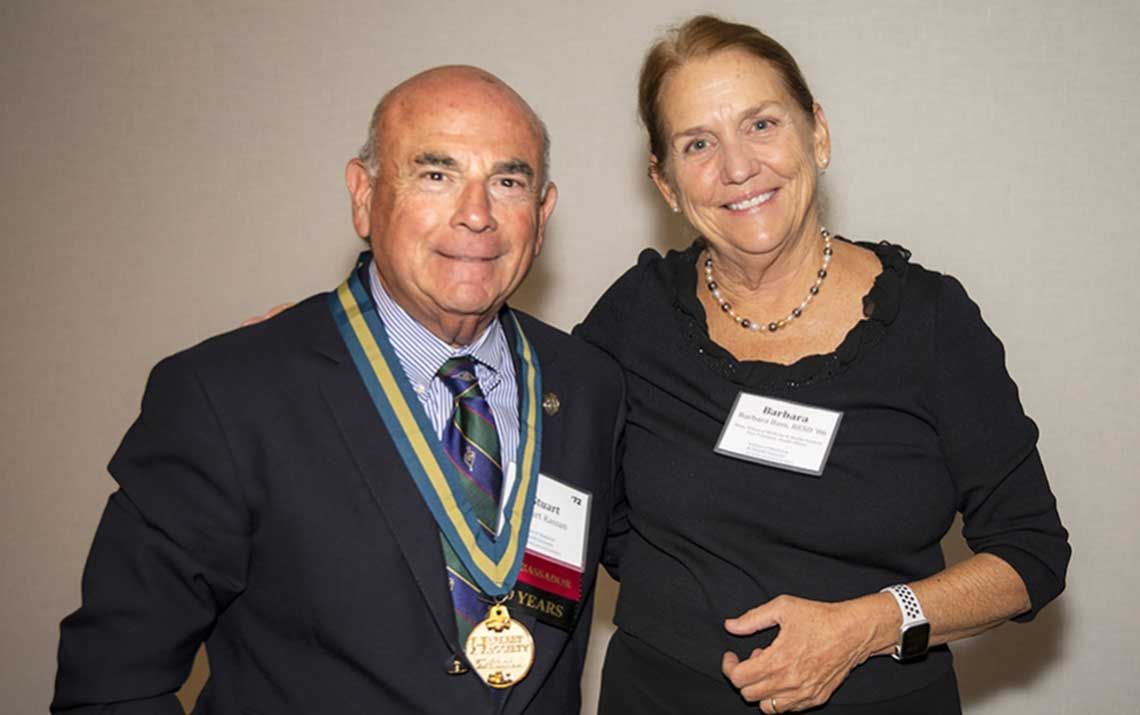 Stuart Kassan, MD ’72, with Dean Barbara L. Bass, MD, at the induction ceremony for the H Street Society