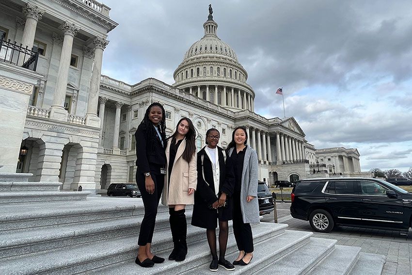 Four HCOP students posing on the steps of the U.S. Capitol