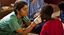 A physician treats a patient