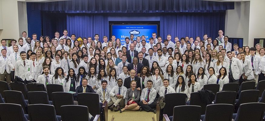 Medical students pose for a photo inside the White House
