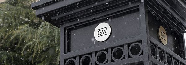 column on campus with the GW logo