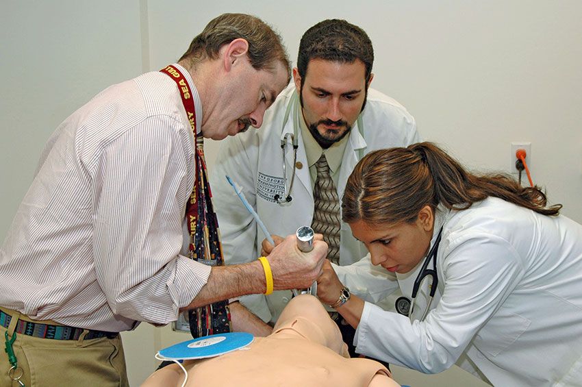 CLASS Center members intubating a practice mannequin