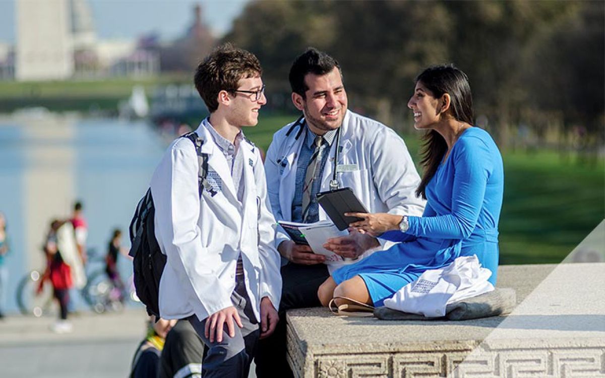 med students talking to each other near the reflecting pool in DC