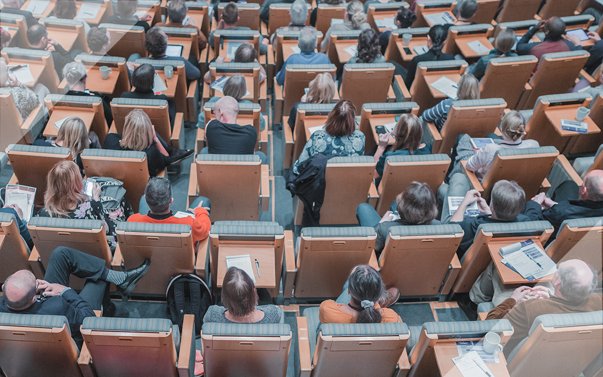 Overhead view of people sitting in a lecture hall