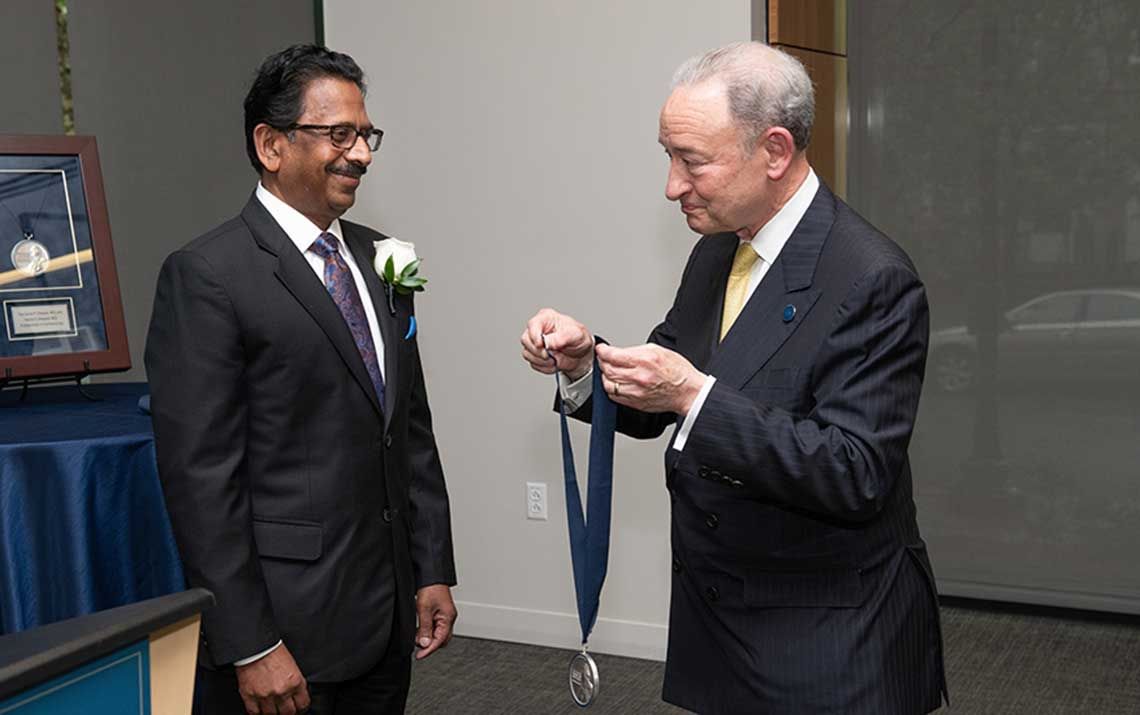 Dr. Raj receives a medal