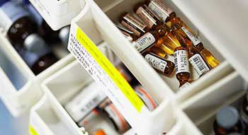 Vials of pharmaceutical drugs in a drawer