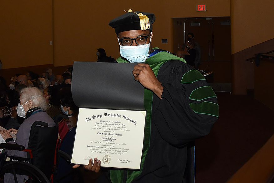 Grad with diploma