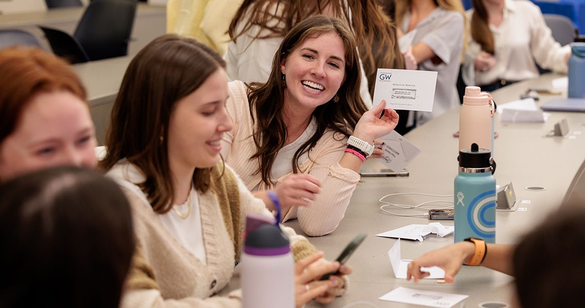 Student hold up her match envelope