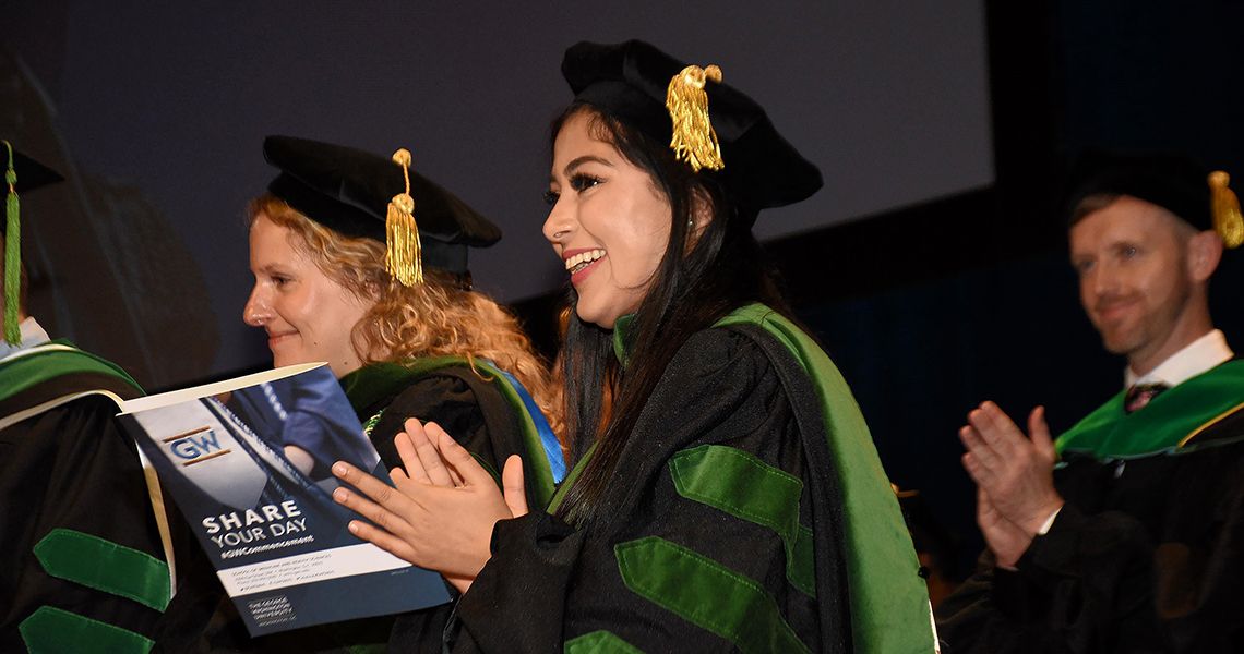 Graduate applauds