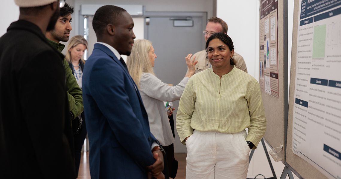 Students explain their research during poster session