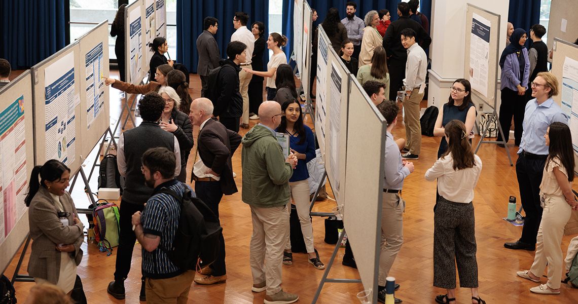 Students explain their research during poster session