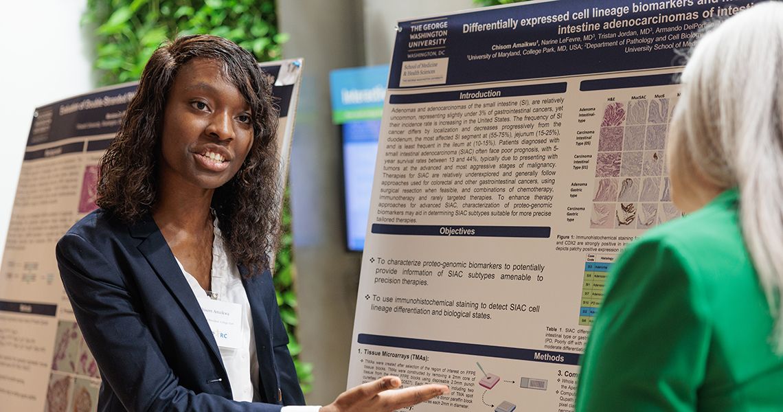 SPARC student discusses research poster