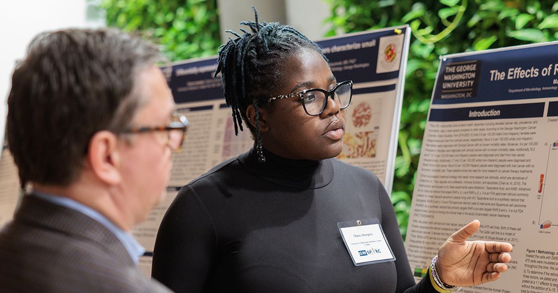 SPARC student discusses research poster