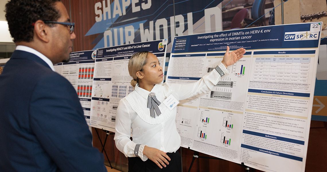 SPARC student discusses research poster