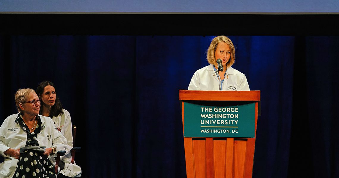 Christina Prather speaks at podium