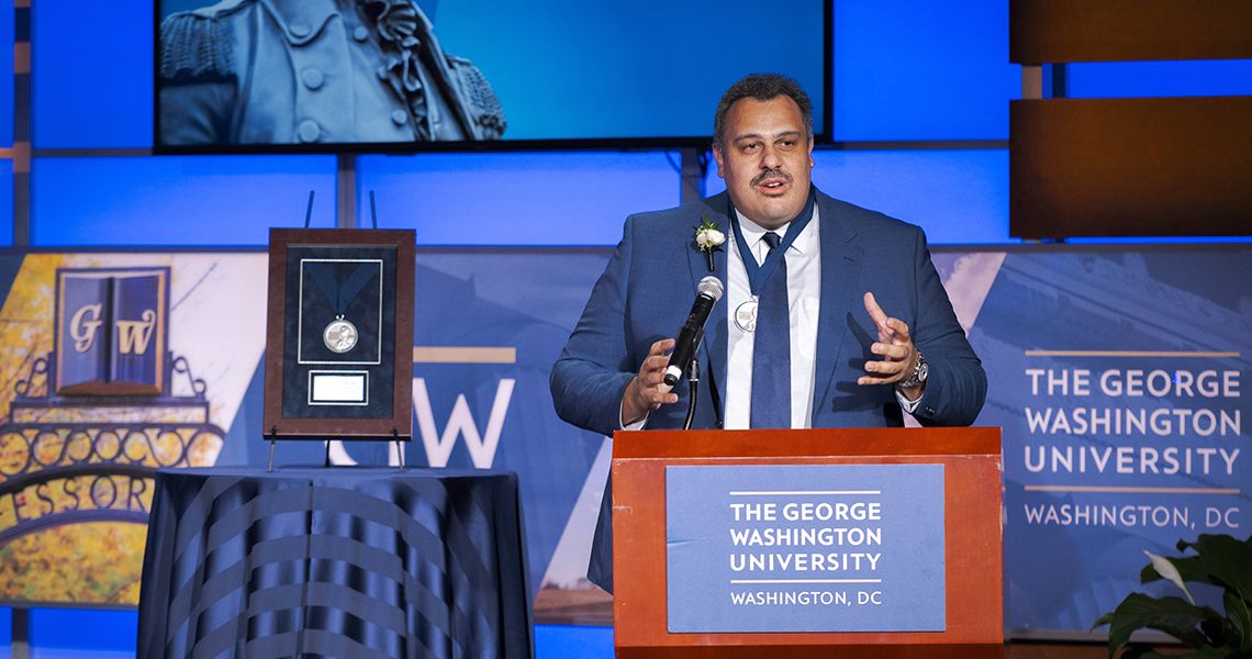 Daniel Carrera, MD, speaks at podium