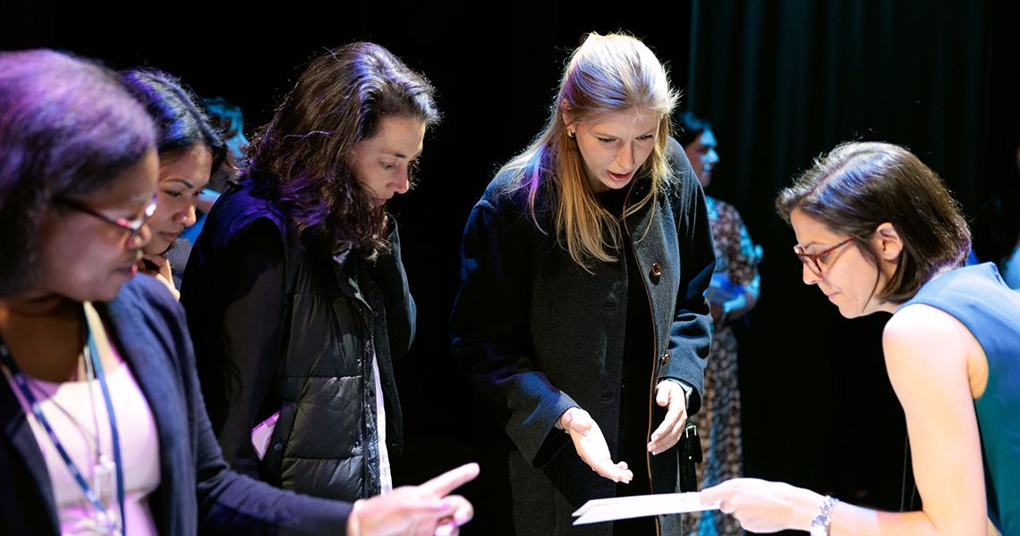 GW SMHS faculty hand out residency match envelopes