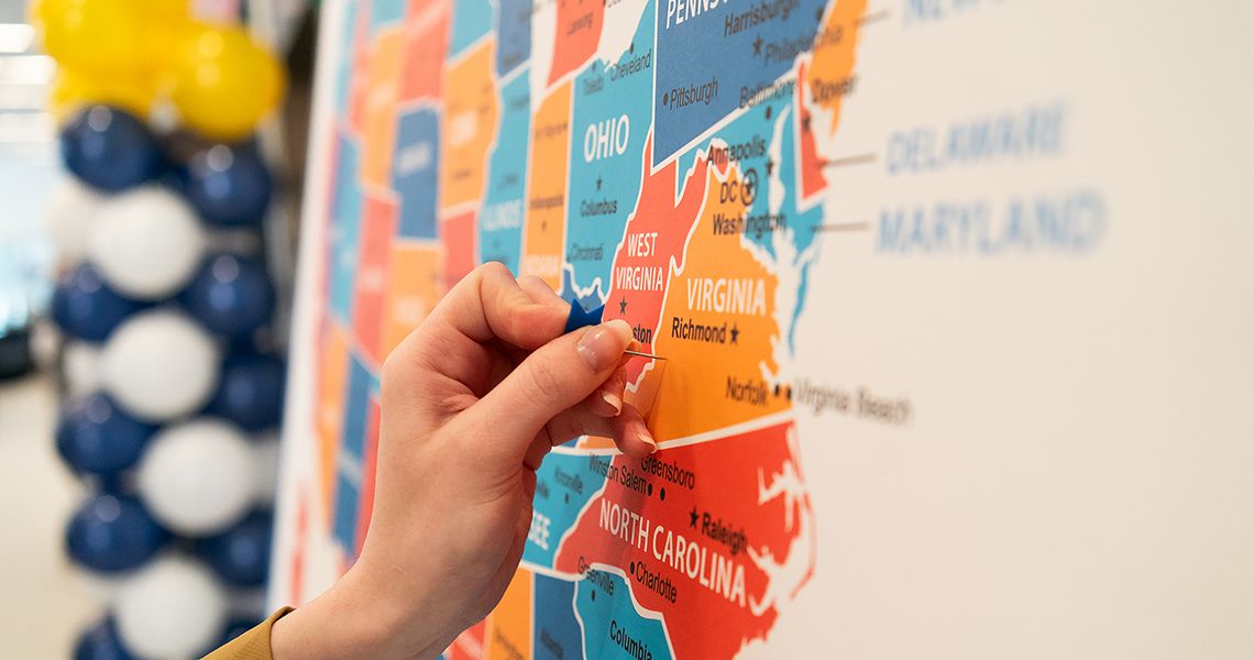 Student puts pin in map showing residency placement
