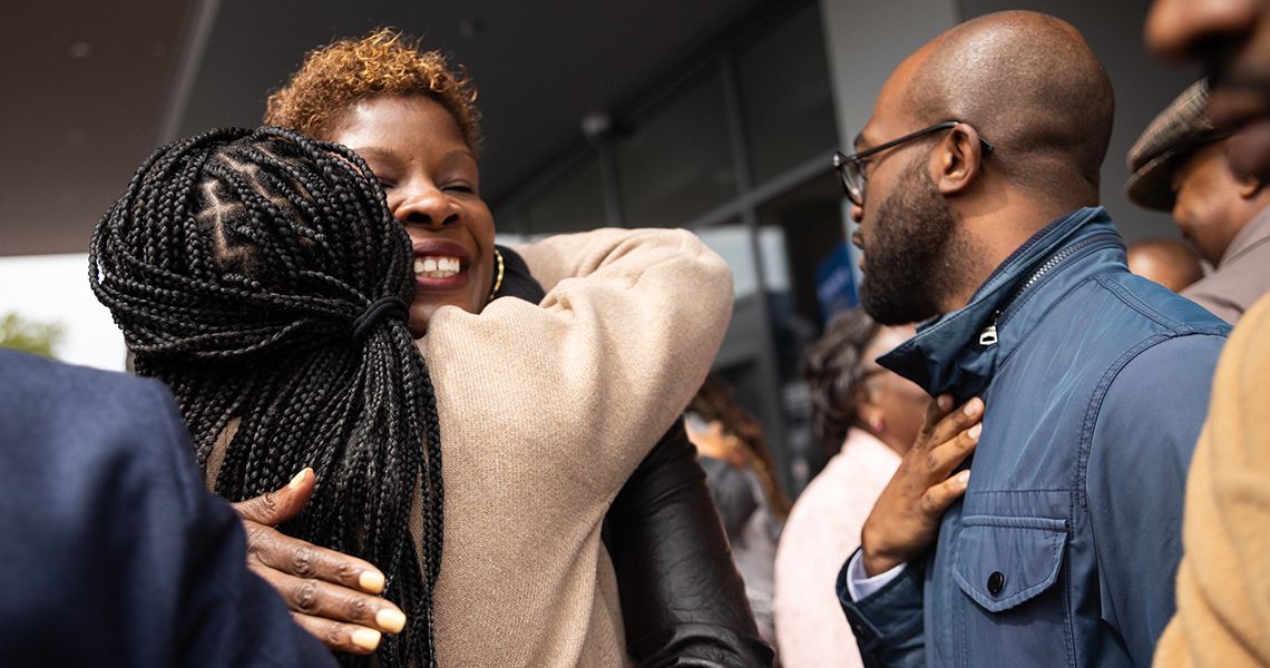 Dr. Nesbitt gets a hug at Cedar Hill ribbon cutting