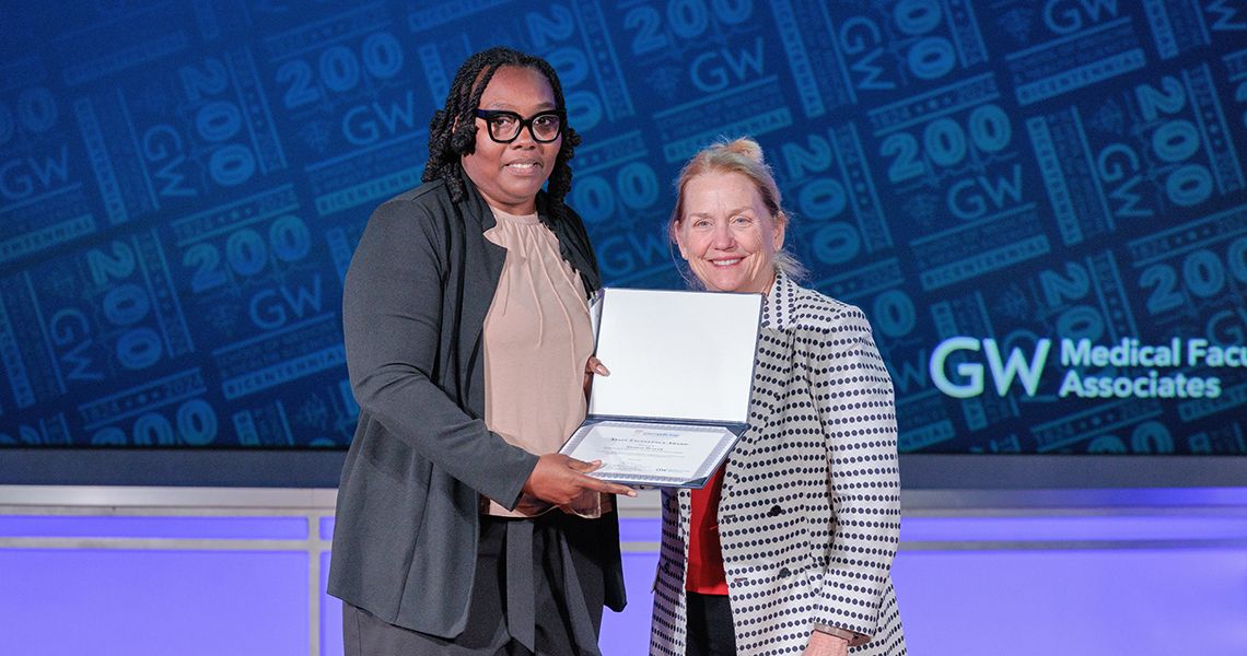Staff Excellence awardee with Dean Bass