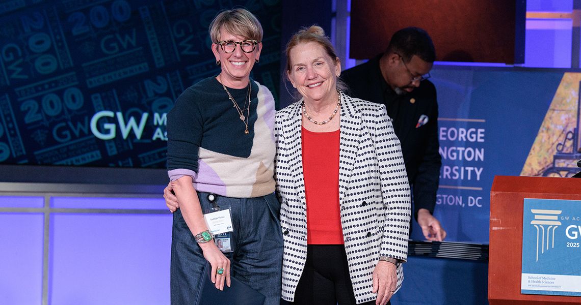 Staff Excellence awardee with Dean Bass