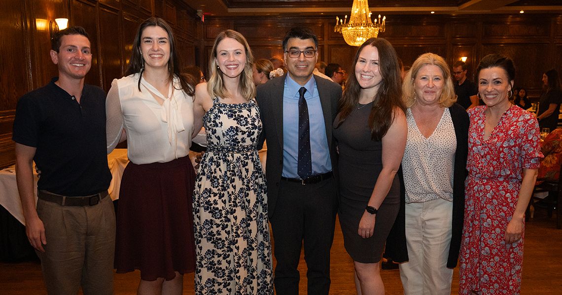 Center, Neal Sikka, MD, RESD ’03, with family and friends