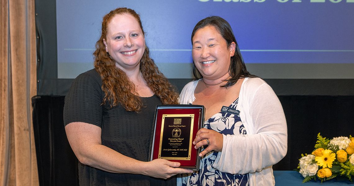 Awardee receiving a plaque 