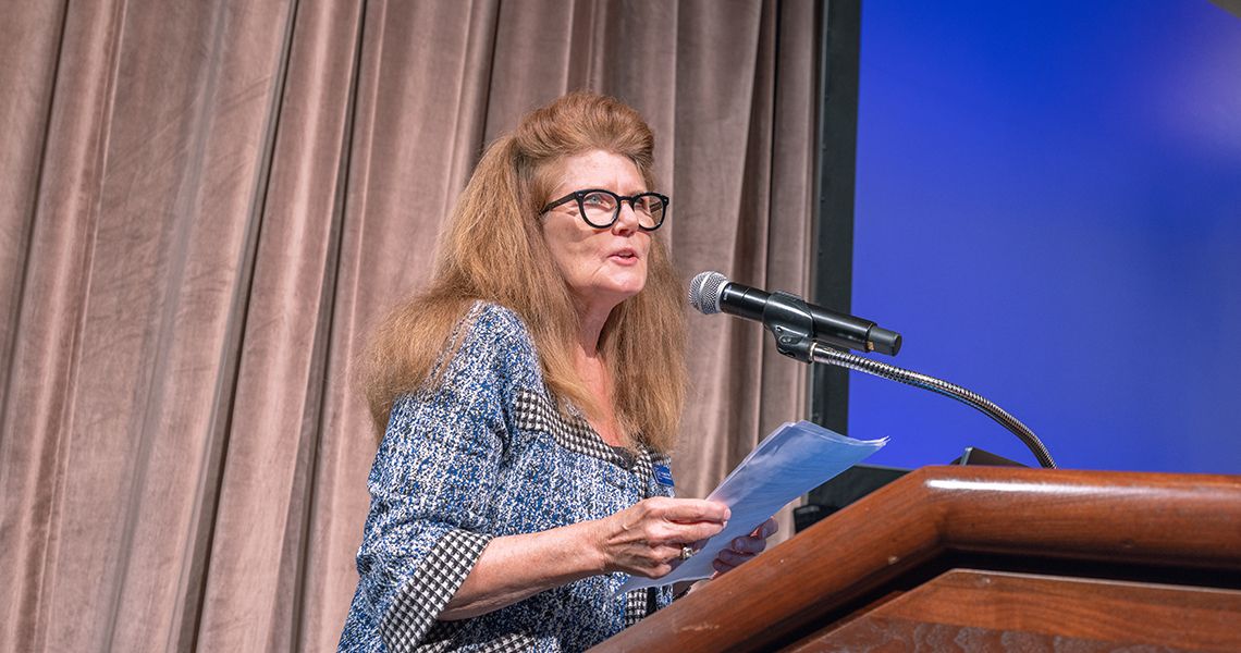Ellen Costello at the podium