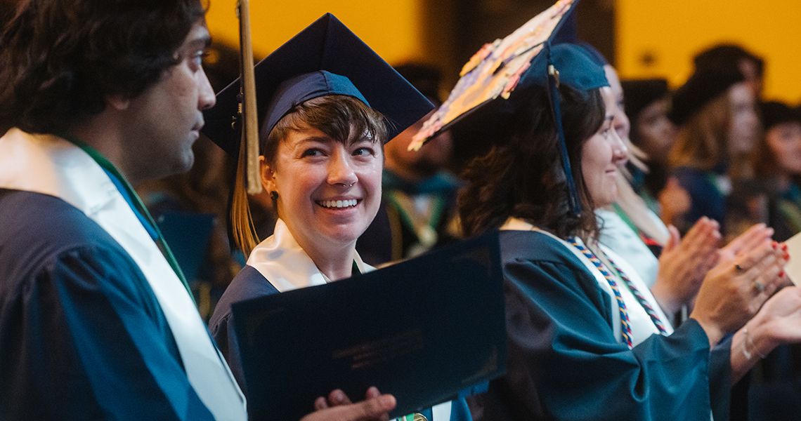 Health Sciences graduate smiles at graduation celebration
