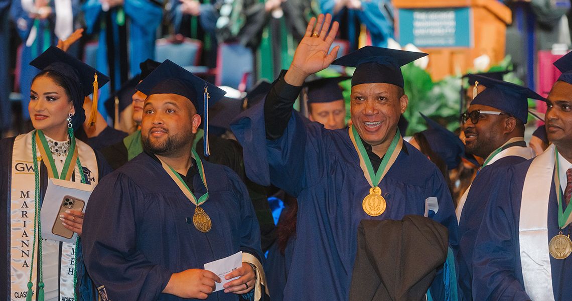 GW SMHS Health Sciences graduates wave to their families
