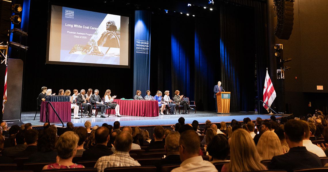 Speaker at podium during PA Long White Coat ceremony