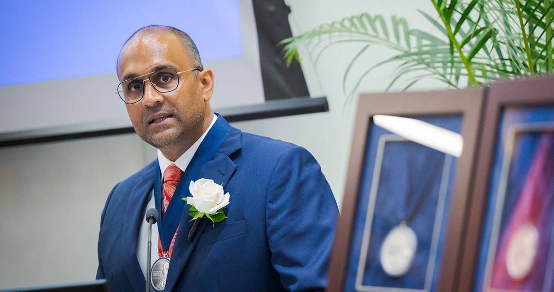 Goyal speaks at the podium