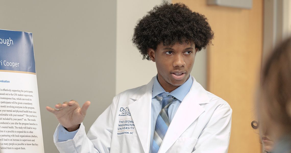 DC High School student presents at end of program research poster session