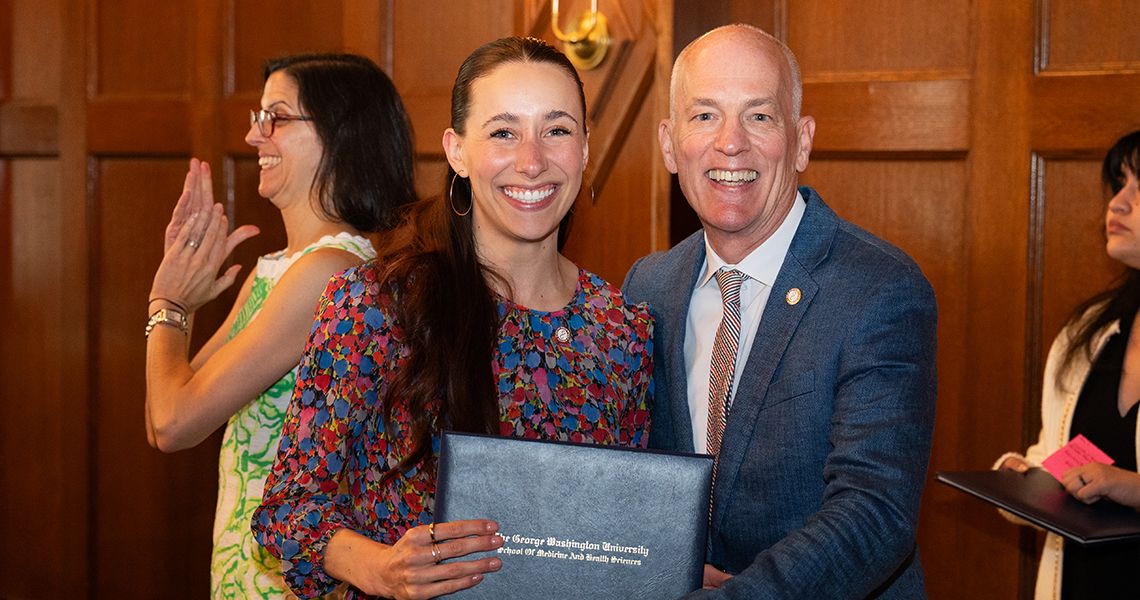 Newton Kendig with Gold Humanism student
