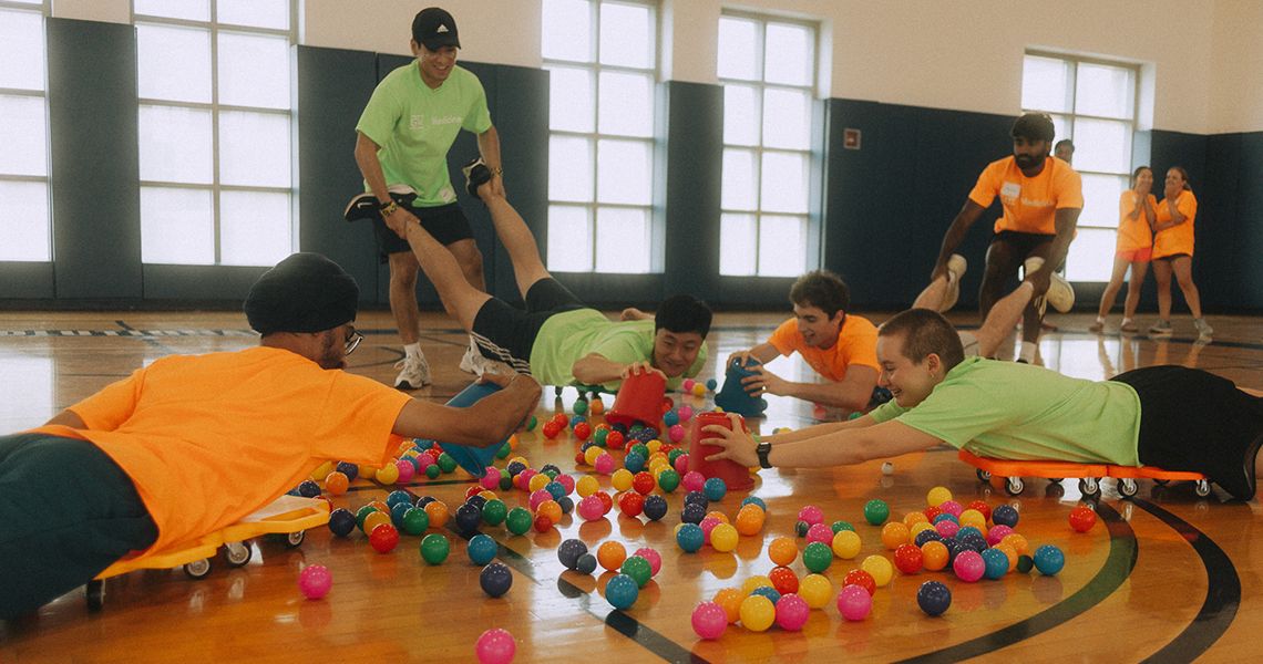 Students compete in team-building games — life-size hungry hippo — on Activities Day