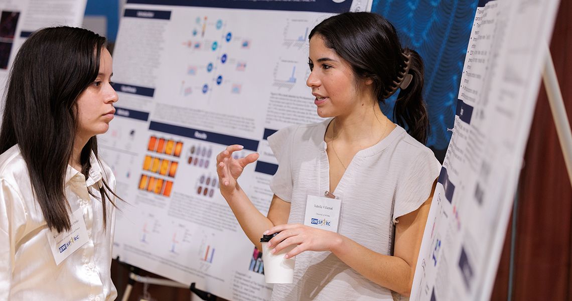 Student presenting research at SPARC Poster Session