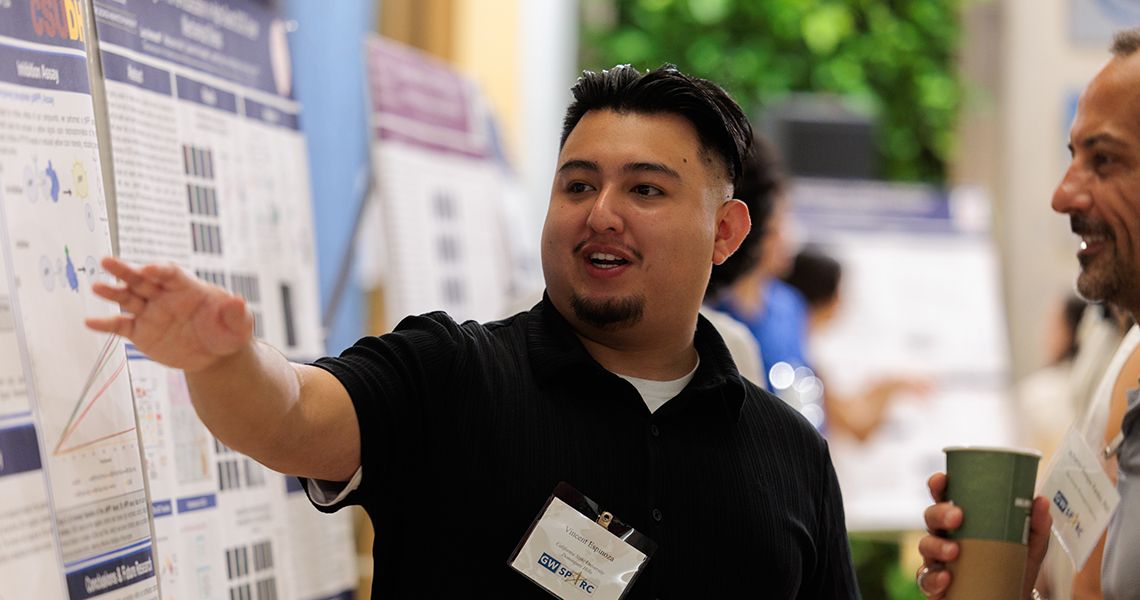 Student presenting research at SPARC Poster Session