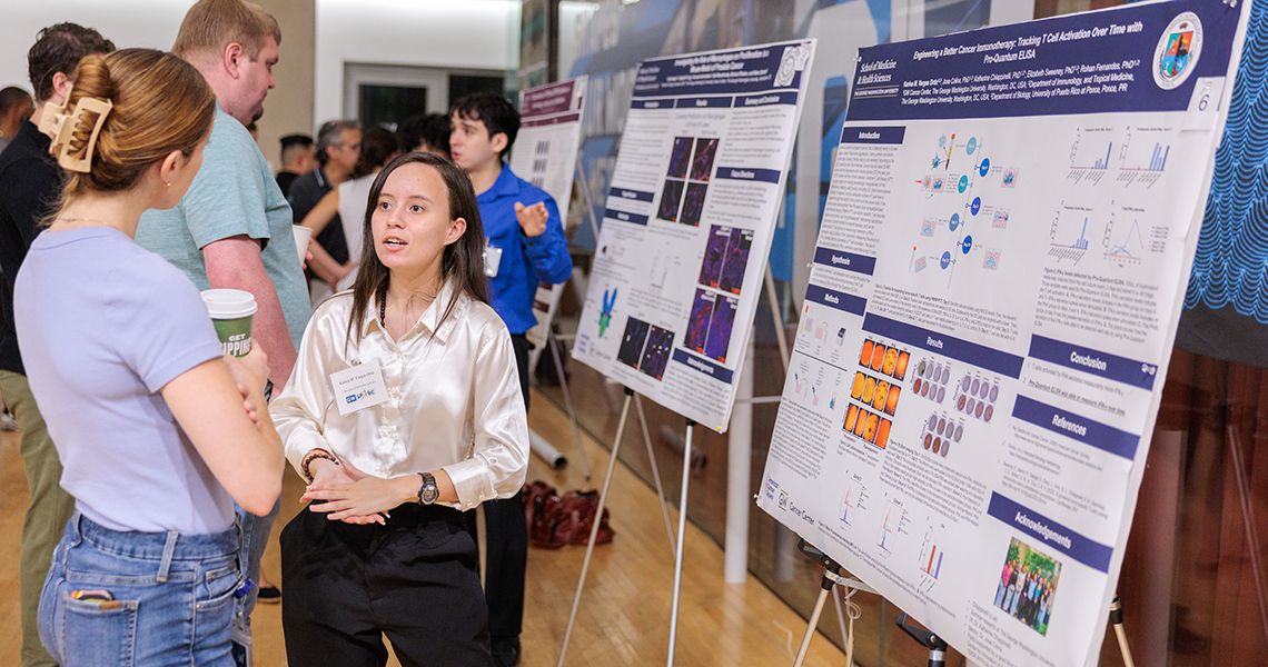 Student presenting research at SPARC Poster Session