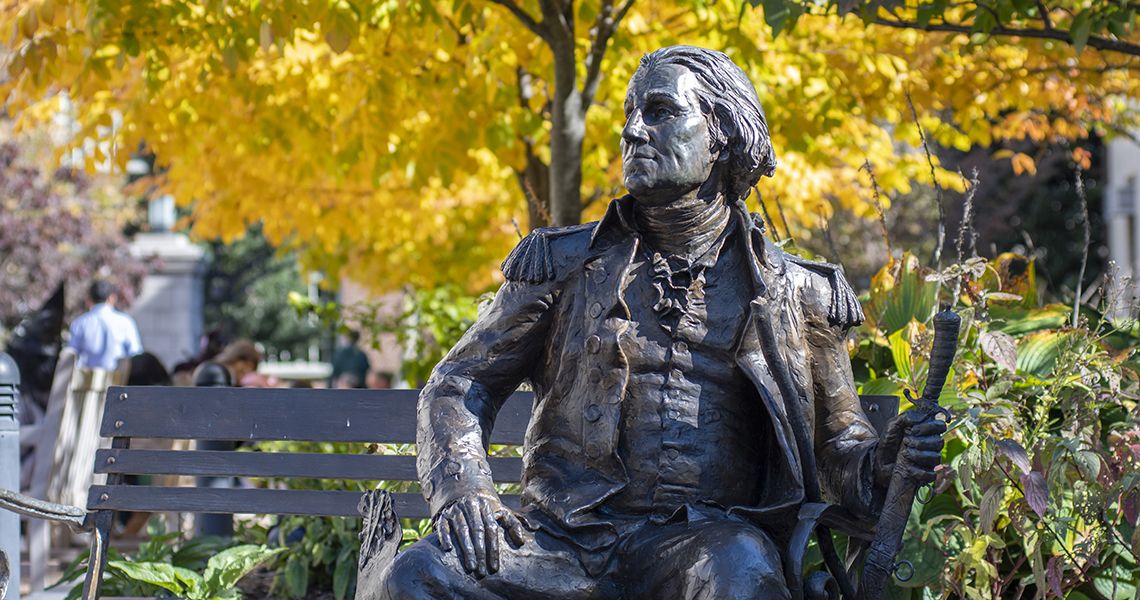 George Statue in Autumn with yellow leaves