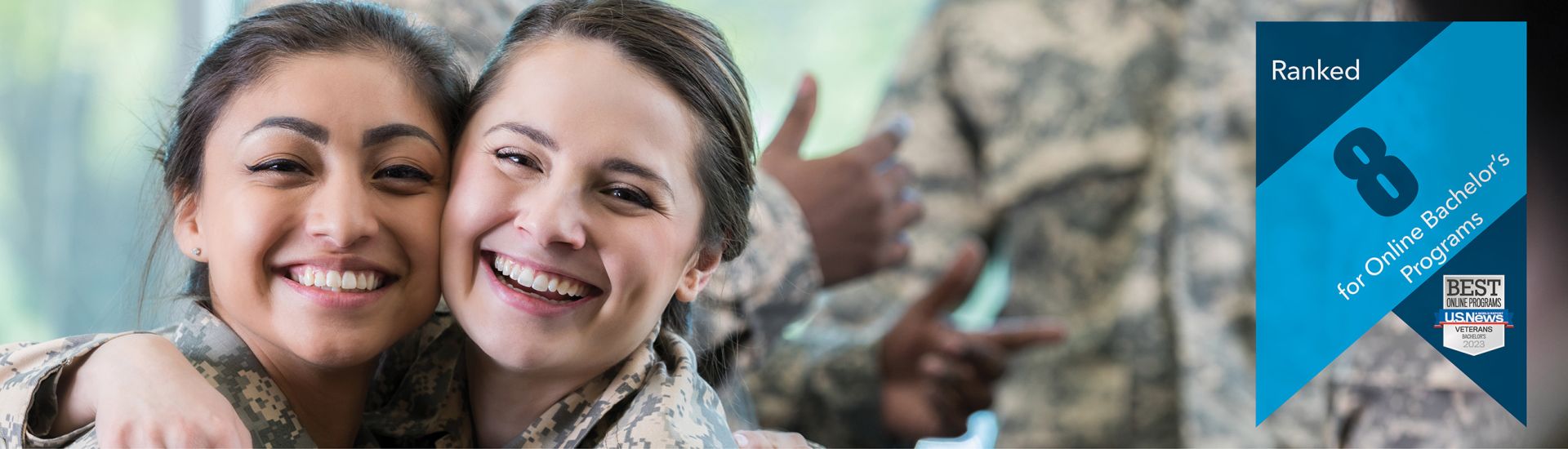 two people in military fatigues hugging and smiling | banner overlaid that reads "Ranked 8 for online bachelor's programs"