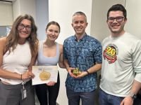 Johnson receives the Golden Apple Award from students