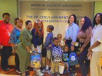 GW Cancer Center staff deliver backpacks for patients' kids 