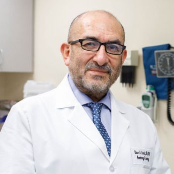 Dr. Elmer Huerta posing for a portrait
