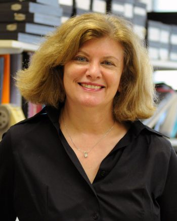 Dr. Kenna Peusner standing in an office for a portrait