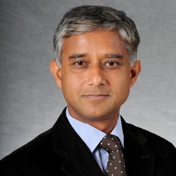 Dr. Raja Mazumder posing for a portrait